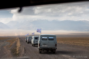 Four UAZs driving towards the Altai Mountains, Mongolia