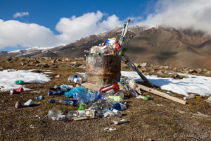 Rubbish bin full of empty bottles, cans and crutches, Altai Mountains Mongolia