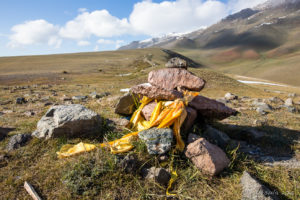 Yellow silk scarves on a rock pile, Altai Mountains, Mongolia