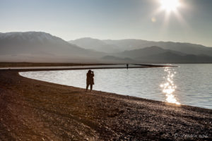 Silhouette of a photographer on Uureg Lake Foreshore, Mongolia