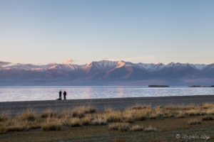 Silhouette of two men on Uureg Lake Foreshore, Mongolia