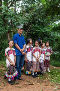 Thai man with Karen school girls, Ban Mae Pae, Mae Hong Son Thailand