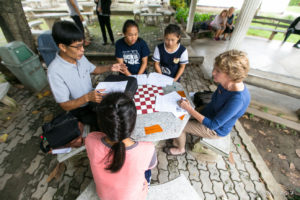 THEP personal and three Thai students around a table, Hod Thailand