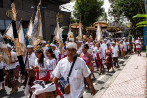 Temple procession with flags and umbrellas, Ubud