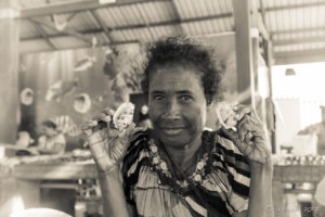 Monochrome portrait of a Papuan woman with shells, Koki Fish Market, Port Moresby PNG