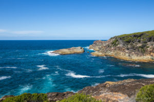 View over the coastline from above Rocky Beach, Bournda National Park, NSW AU