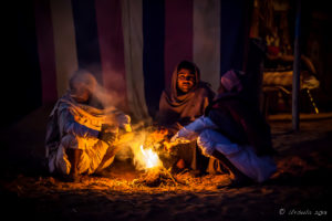 Indian men around a camp fire in the dark, Rajasthan