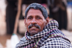 Indian man in a checkered Scarf, Pushkar Fair Grounds, Rajasthan
