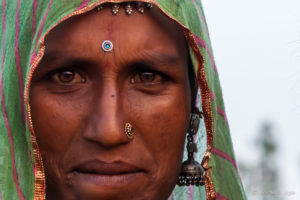 Closeup of an Indian woman in a green dupatta, Pushkar Fair Grounds, Rajasthan