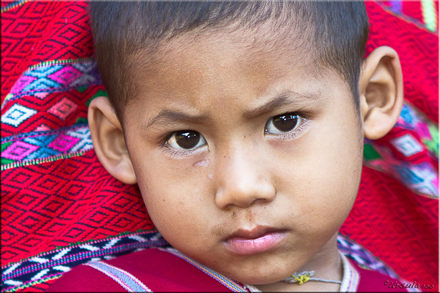 Solemn faced Karen boy aged four