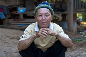 Squating Karen Man with traditional tattoos