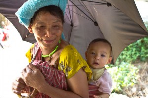 Karen woman with baby on her back