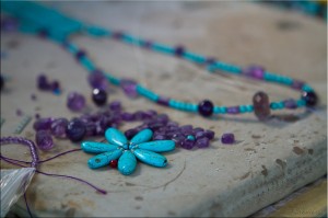 Close-up of turquoise amethyst pieces on a stone work-table