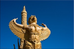 Giant yellow-painted garuda and candle sculpture, Ubon Ratchathani