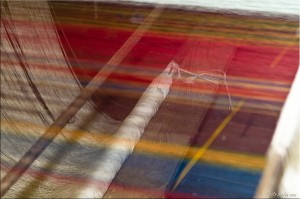 Colourful weft threads on a silk loom