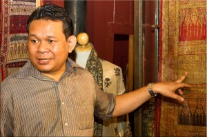 Thai male (Ajarn Weeratham Trakulngernthai) explaining traditional silk patterns