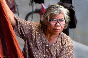 Thai woman with length of silk