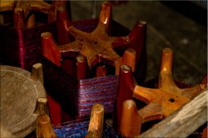 Large wooden spools of silk threads