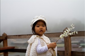 Portrait: Toddler in white against morning mists