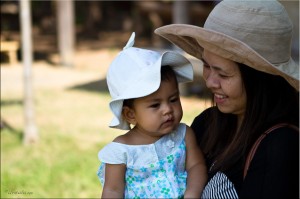 Portrait: Thai mother and infant in sunhats