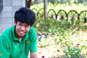 Portrait: Young Thai man in green shirt