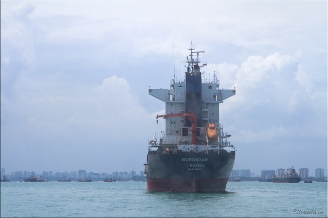 Ship on the South China Sea, Singapore skyline distant