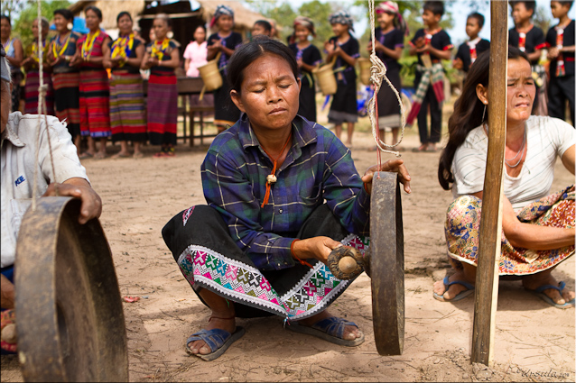 Lawae Woman Playing a Gong