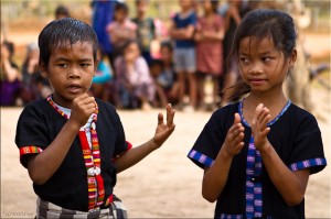 Lawae boy singing: girl clapping time