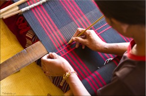 Hands Interweaving Red and Blue Cotton