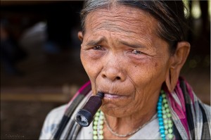 Portrait: Older Lawae Woman with Pipe