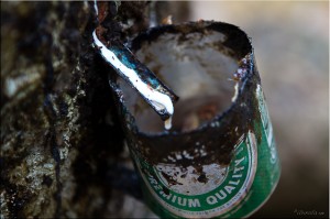 Rubber dripping into half beer can