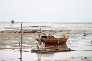 Wooden fishing Boat on Mud Flats, Bintan Indonesia