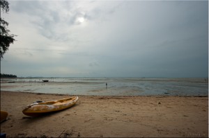 Sea kayak on beach at low tide