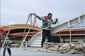 Mann trowing ropes onto Dock ~ Tanah Merah Ferry Terminal, Singapore