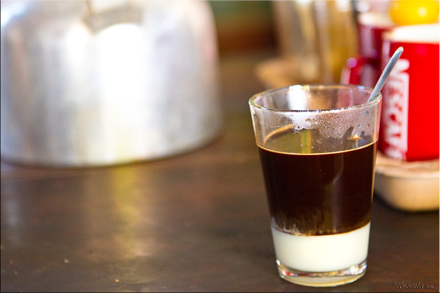 A glass of Lao Coffee, or Pakxong Coffee with a Layer of Condensed Milk at the Bottom