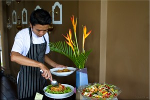 Young Thai male Serving Som Tam