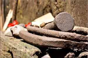 Rusty iron railway spikes and ties