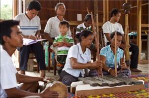 Oye women playing a Wooden Xylophone