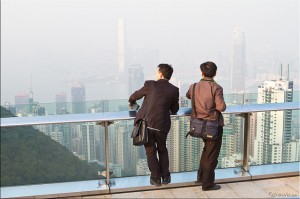 Two men looking over Hong Kongfrom the Sky Terrace