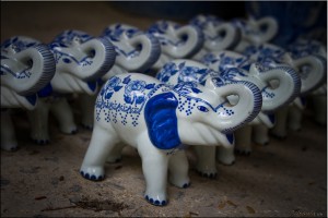 Small blue and white ceramic elephants