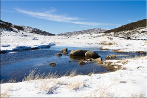 Snow and ice on water and rock, Spencers Creek, Australia
