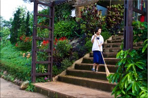 Thai schoolgirl sweeping steps