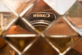 Reflection of Canon Logo in gold ornament