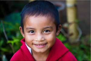 Portrait: Smiling Karen girl with short hair