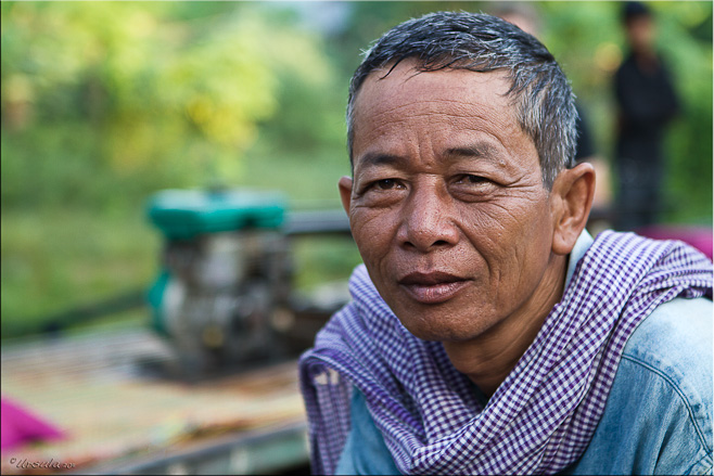 Portrait: Khmer man with norrie motor behind him