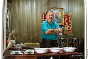 Sino-Thai male standing in his shop office