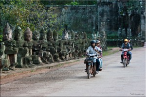 Five male kmer workers on two motorcycles, South Gate, Angkor Thom