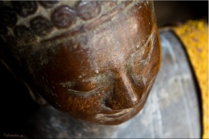 Looking down on a bronze-coloured Buddha image