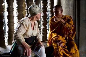 Elderly French woman in discussion with a young Khmer Theravada monk, Angkor Wat