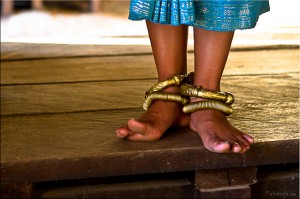 Detail: Feet of an apsara dancer, with anklets and curled toes.
